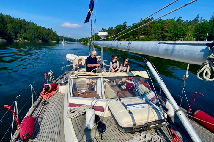 a boat is docked next to a body of water