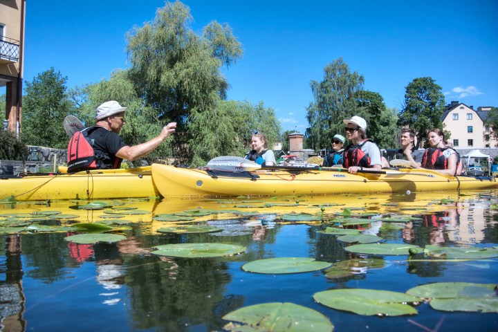 a group of people on a boat in the water