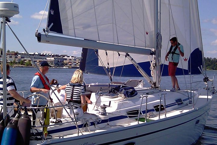 a group of people in a boat on a body of water