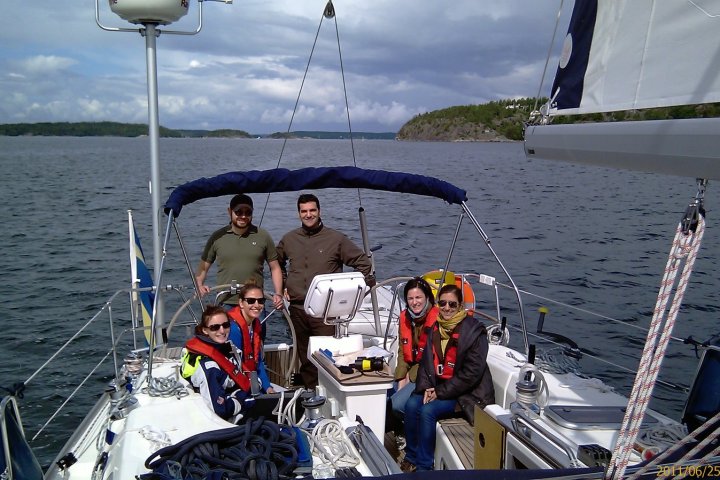 a group of people in a boat on a body of water