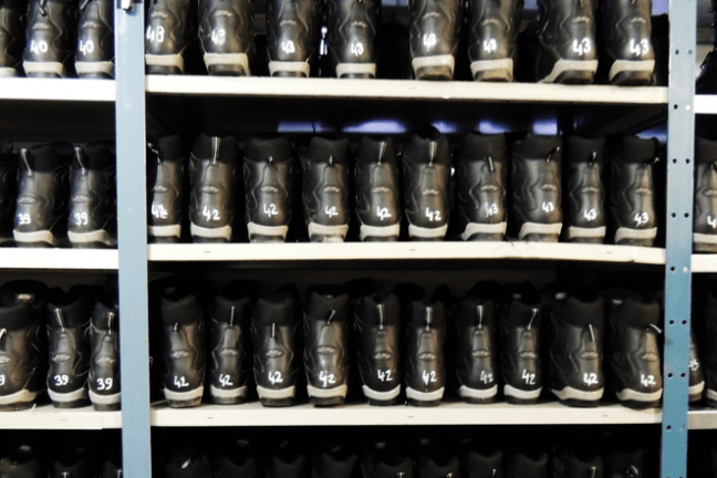 a store shelf filled with wine glasses