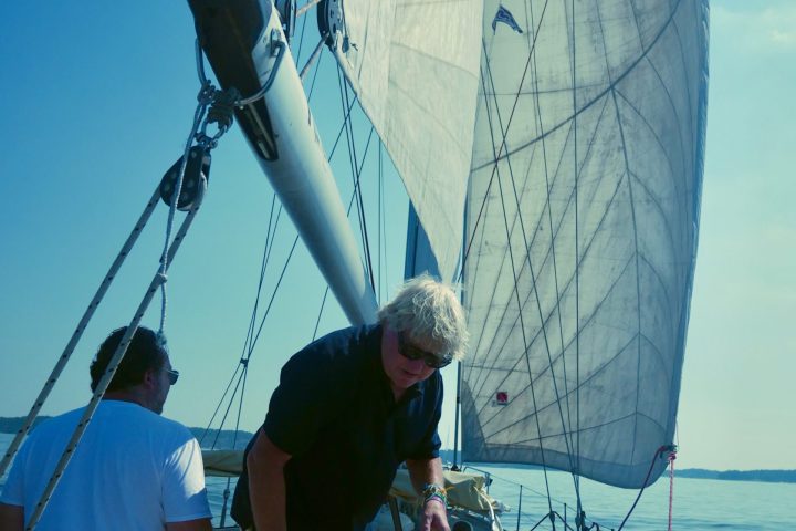 a group of people standing on a boat