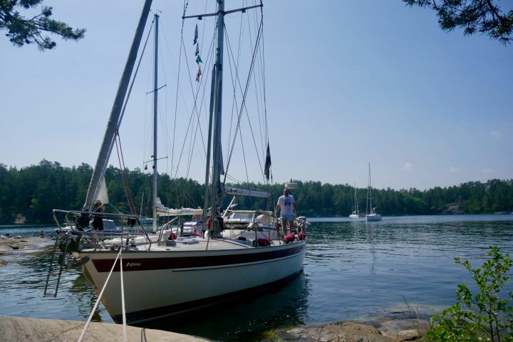 a boat is docked next to a body of water