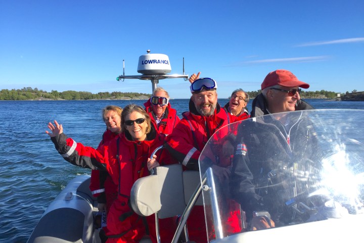 a group of people on a boat in the water