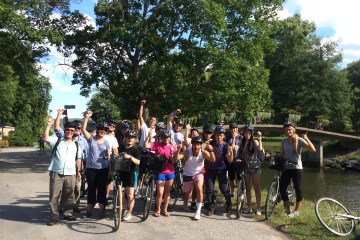 group posing for camera on guided bike tour in stockholm