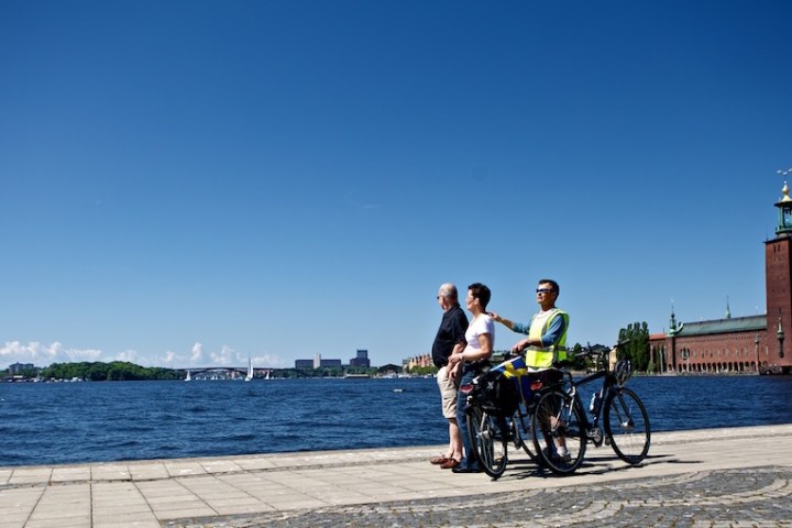 a person riding on the back of a bicycle