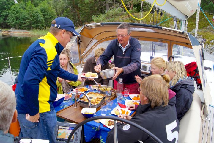 a group of people riding on the back of a boat