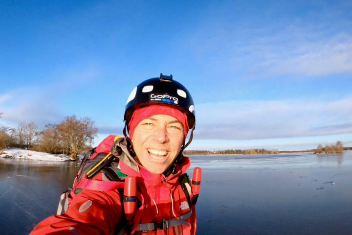 Happy person smiling while skating on natural ice