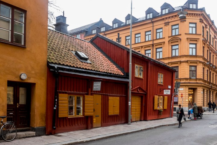 a city street in front of a brick building
