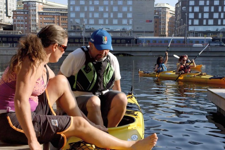 a group of people on a boat in the water