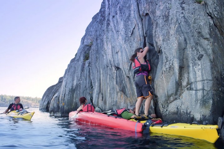 a group of people on a boat in the water
