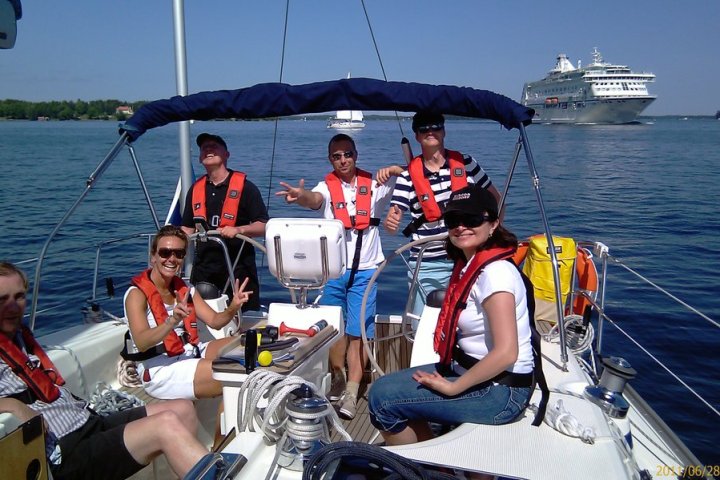 a group of people in a boat on a body of water