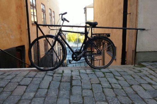 a bicycle parked on the side of a building