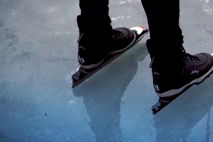 a person gliding over natural ice