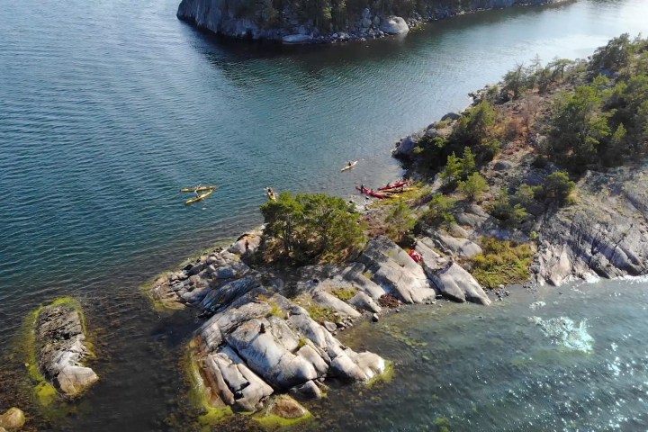 a large waterfall over a body of water