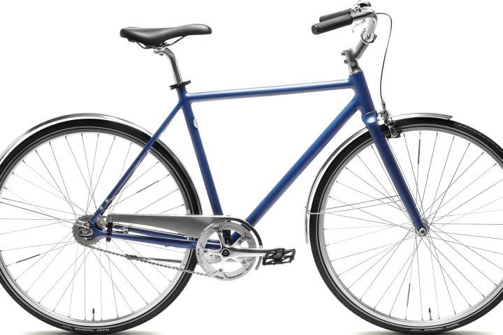 Blue single-speed bicycle with black saddle and silver handlebars.